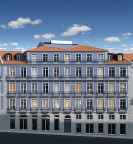 Facade of a restored Lisbon building with blue tiled walls