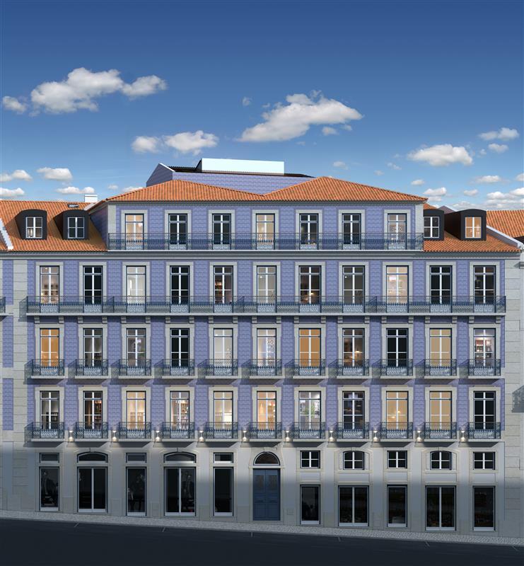 Facade of a restored Lisbon building with blue tiled walls