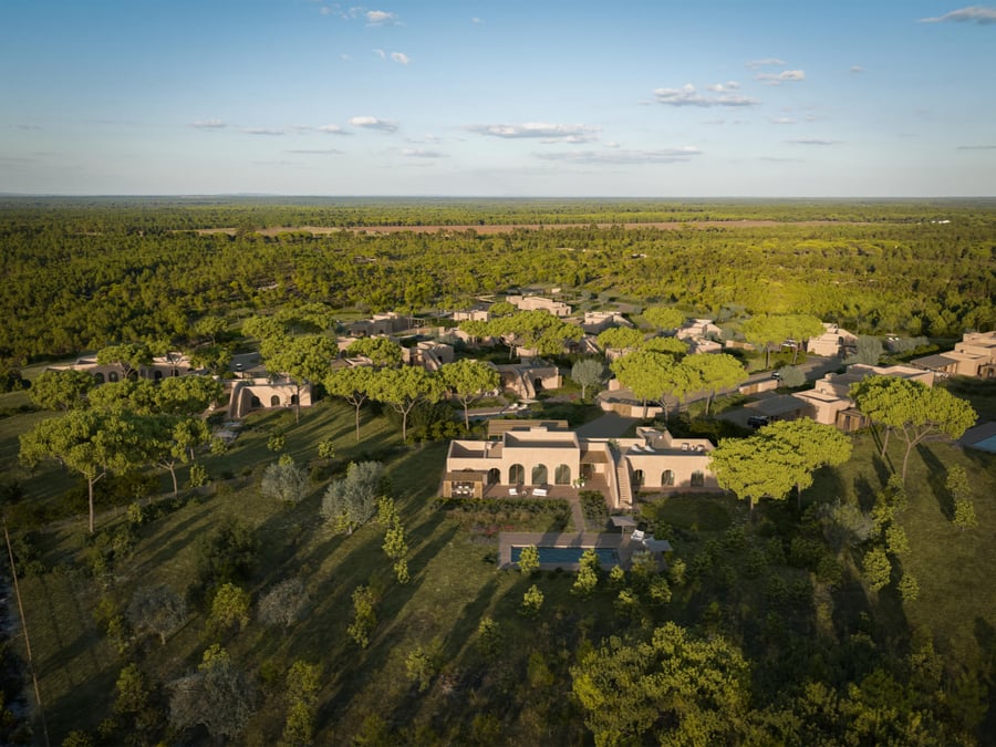 Aerial view of Ando Living Comporta, a luxury development featuring private villas seamlessly integrated into nature. Sustainable architecture and contemporary elegance in the natural landscape of Comporta, Portugal.